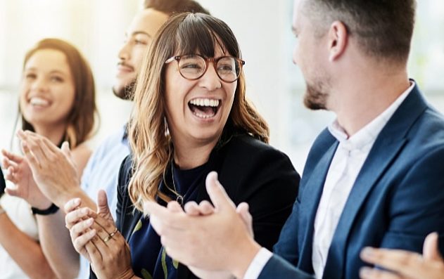 People smiling and clapping