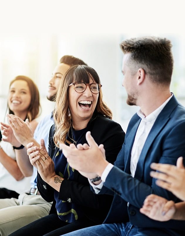 People smiling and clapping